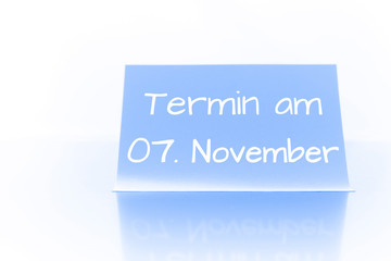 Termin am 7. November - blauer Zettel mit Notiz