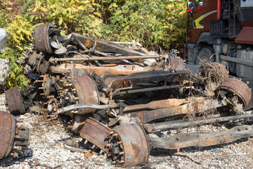 Fototapeta na wymiar Remnants of vehicles in the dump. Vehicle disposal parts