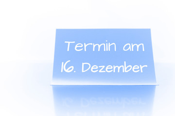 Termin am 16. Dezember - blauer Zettel mit Notiz