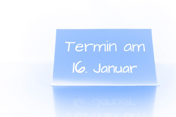 Termin am 16. Januar - blauer Zettel mit Notiz