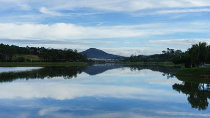 Fototapeta na wymiar blue sky reflection on the lake
