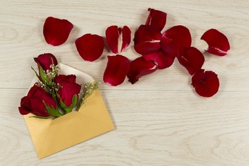 Rose bouquet and petals with envelope