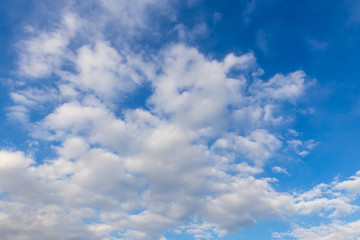 Naklejka na ściany i meble Clouds against blue sky as abstract background