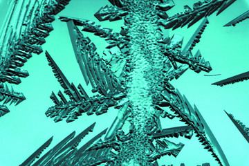 Frozen snow on the window glass as background