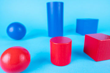 Blue and red geometric shapes on blue background.