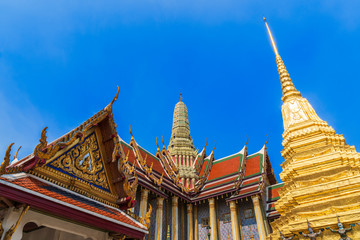 Fototapeta premium Photo of Golden pagoda and temple of Wat Phra Keaw, the emerald buddha, Bangkok.