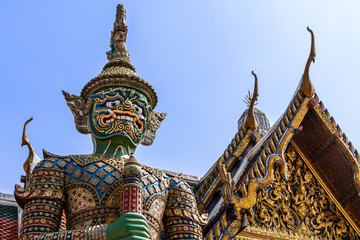 Naklejka premium Thai antique sculpture, giant sculpture at Wat Phra Keaw, temple of the emerald buddha, Bangkok