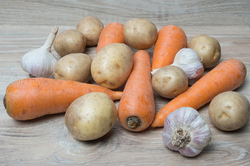Image of potatoes, carrots and garlic. Set of raw vegetables.