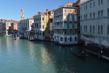 Fototapeta na wymiar Gondolas Sailing Near The Beautiful Palaces Of The Grand Canal In Venice. Travel, Holidays, Architecture. March 27, 2015. Venice, Region Of Veneto, Italy.
