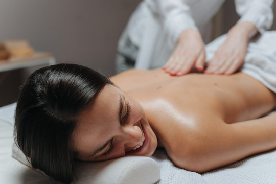 Woman Enjoying a Back Massage .
