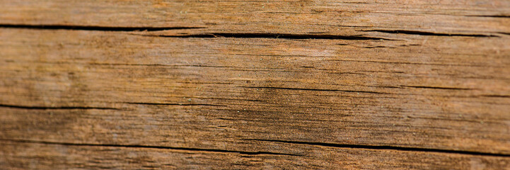 Old wooden board covered with cracks.