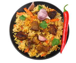 pilaf with meat and chili pepper on black plate isolated on white background. top view