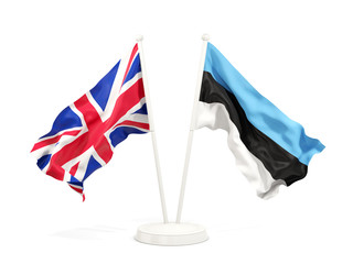 Two waving flags of UK and estonia