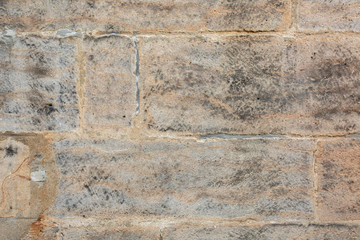 Closeup texture of plaster wall with huge bricks