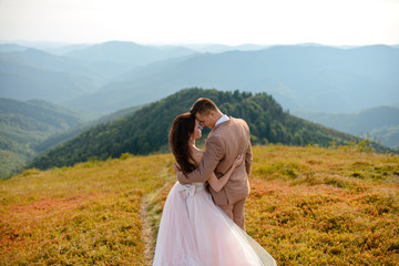 Young love couple celebrating a wedding in the mountains