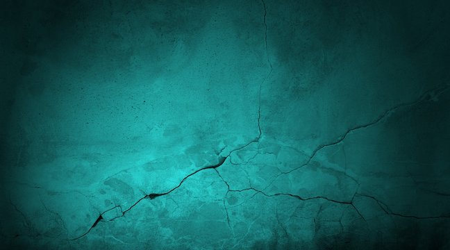 Kaputte blau gr&uuml;ne Steinwand aus Beton mit Riss