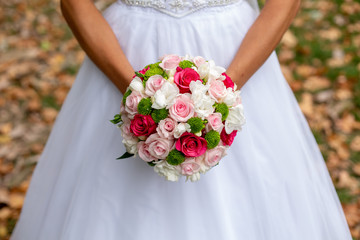 Bride in White Dress Holding Splendid Bridal Boquet Colorful