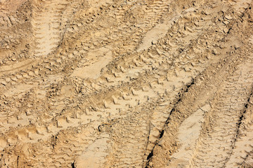 Traces of tire treads on the sand.