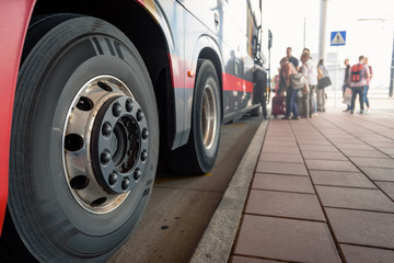 Closeup of modern public bus with open door at bus station © Denys Kurbatov