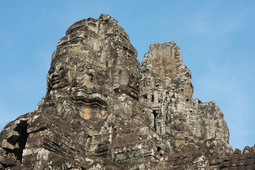 Fototapeta na wymiar Siem Reap,Cambodia-Januay 11, 2019: Bodhisattva face towers viewed near the east gate of Bayon, Angkor Thom, Siem Reap