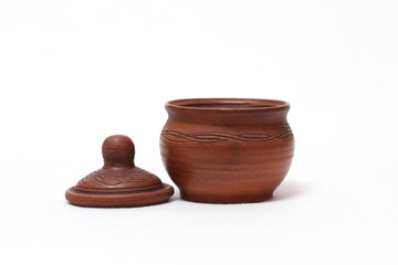 Clay dishes, pot with a lid made of clay isolated on white background