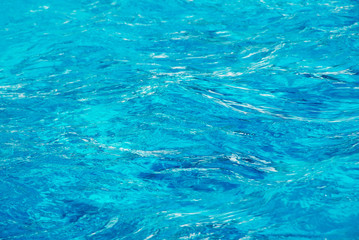 water in swimming pool rippled water detail background