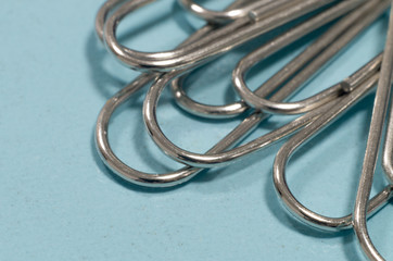 blue paper clips on white background