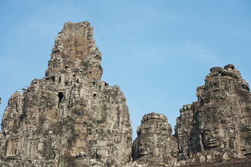 Fototapeta na wymiar Siem Reap,Cambodia-Januay 11, 2019: Bodhisattva face towers viewed near the east gate of Bayon, Angkor Thom, Siem Reap 