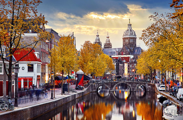 Amsterdam, Netherlands. Autumn sunset in Red-light district. - obrazy, fototapety, plakaty