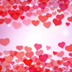 Valentines Day background with scattered blurred tender hearts