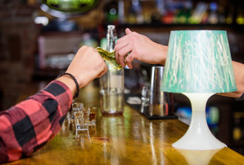 Cash payment. Ordering drinks in bar. Purchase and payment. Cash money concept. Leave tips for bartender. Tip given to waiter. One more alcohol cocktail. Hand hold dollar money cash at bar counter