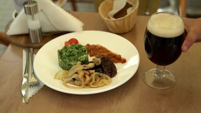 Blood sausage, blood pudding with beer. Oats, barley. Traditional Latvian food. 4K