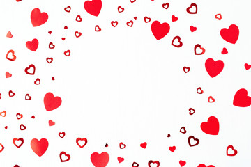 Wreath frame made of paper heart symbols on white background. Flat lay, top view Valentines Day background love concept.