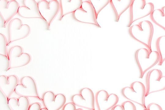 Wreath frame mock up made of paper heart symbols on white background. Flat lay, top view Valentines Day background love concept.