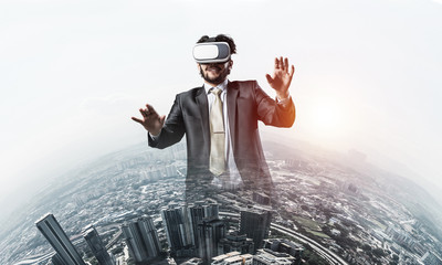 Handsome elegant businessman experiencing impressive virtual rea