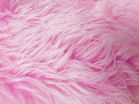 detail of abstract texture background with sweet pink fur, background of artificial fuzzy fur in pink color, beautiful close up of light pink fake fur background for decoration