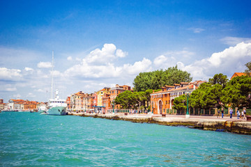 Obraz premium Panoramic view of Venice from Grand Canal to embankment of city with moored ships, Venice, Italy