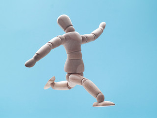 man jumping on blue sky background