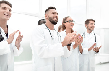 Doctors applaud at a conference