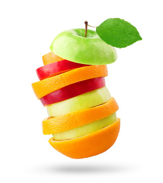Fruits. Stack of apple and orange slices on white