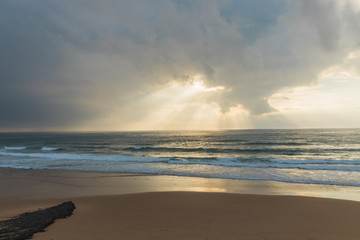 Sunset behind clouds
