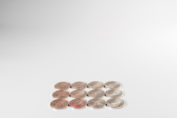 Rows of silvery spanish peseta coins isolated on white background.