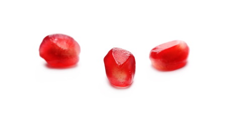 Pomegranate seeds isolated on white background, macro