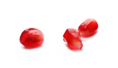 Pomegranate seeds isolated on white background, macro