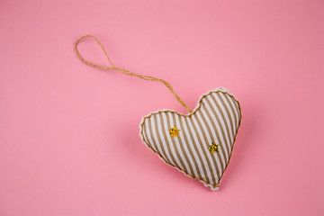 top view cute stuffed toy in form of heart on a pink background