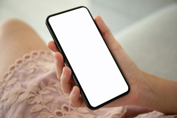 female hands in pink dress holding phone with isolated screen