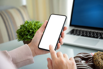 female hands holding phone with isolated screen in the office