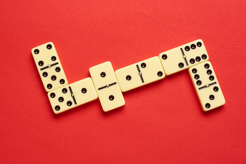 Domino on red background. Flat lay. top view