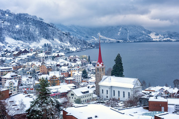 Weggis village on Lake Lucerne, swiss Alps mountains, Switzerland, in winter time