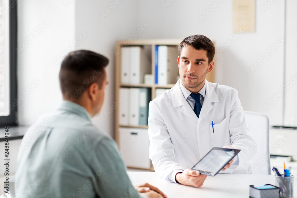 Poster medicine, healthcare and technology concept - doctor with tablet pc computer and male patient talking at medical office in hospital